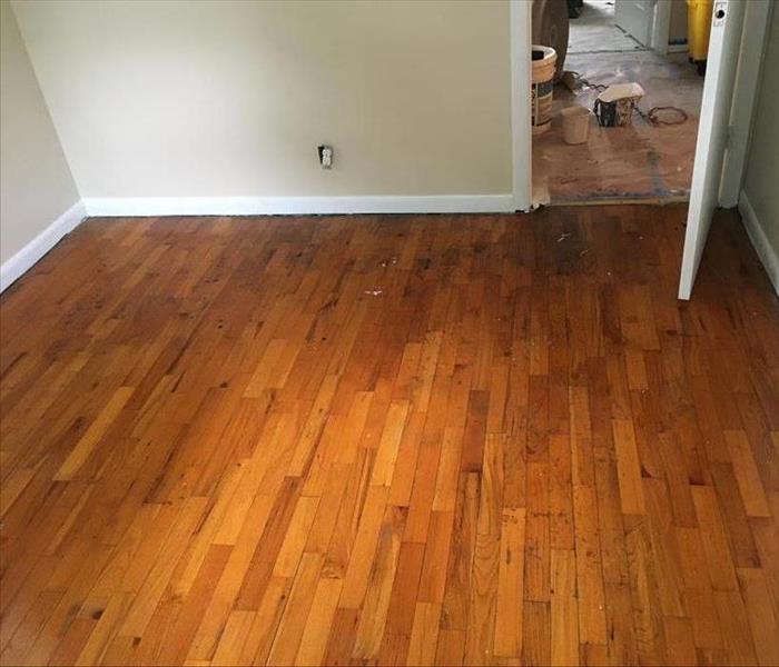Hardwood floor after being cleaned by our heroes