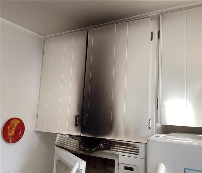 Kitchen cabinets full of soot