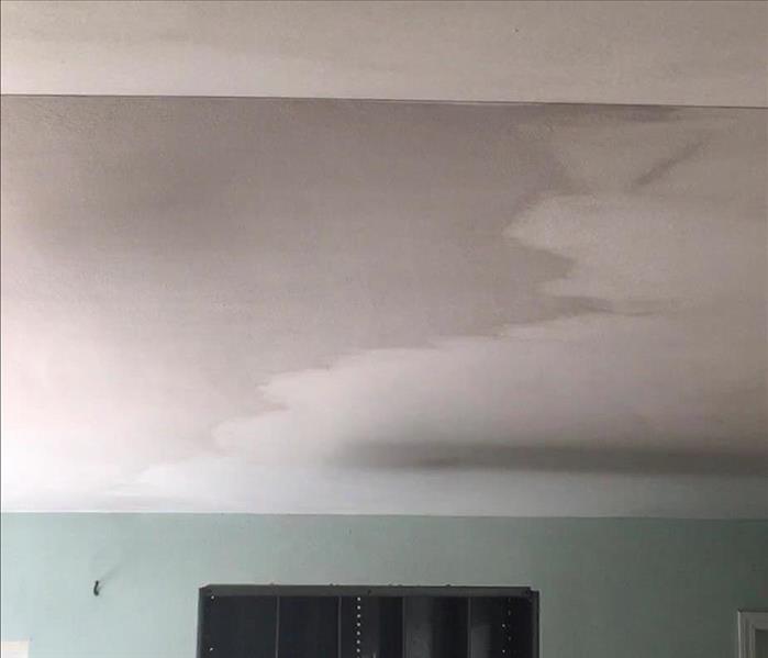 Ceiling in the process of getting cleaned from fire