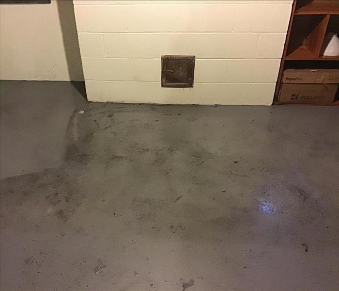 Water and soot in basement after fire.