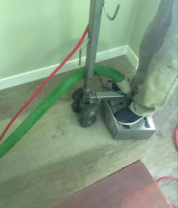 Hydro-X Water Extractor being used on wet carpet.